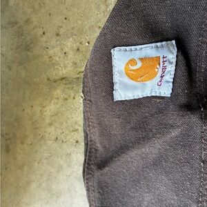 Carhartt Dark Brown Canvas Workwear Piece with Orange Logo Patch